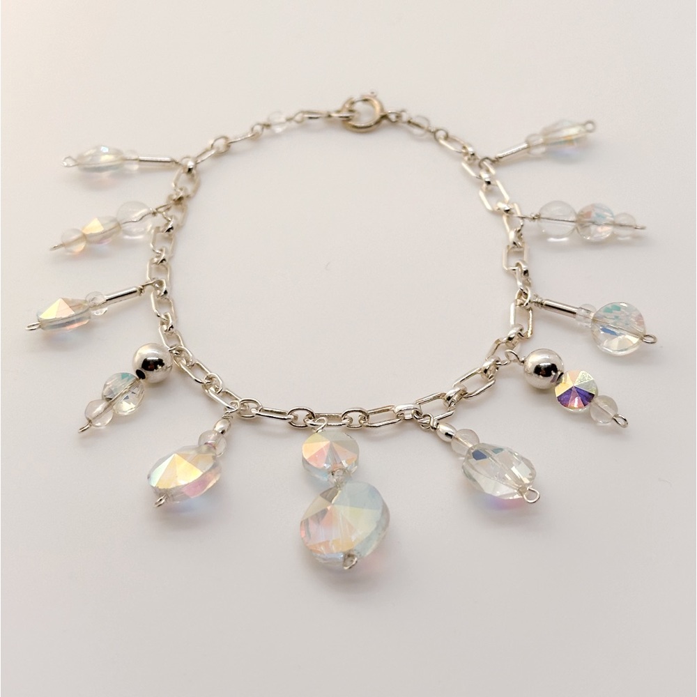 Handmade bracelet with antique & glass beads, silver beads, chain & findings.